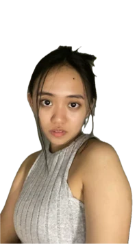 a girl in a gray tank top posing for a picture