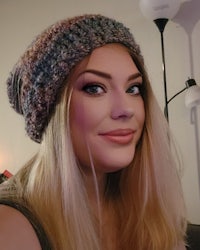 a blonde woman wearing a crocheted beanie