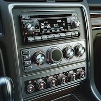 the interior of a car with a radio and controls