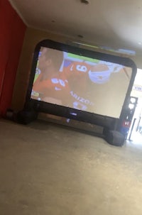 a large inflatable screen in the middle of a room