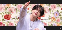 a picture of a man pointing at a floral background