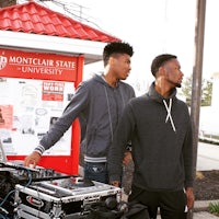 a man wearing a black hoodie