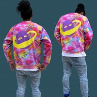 the back of a man wearing a colorful jacket with a saturn on it