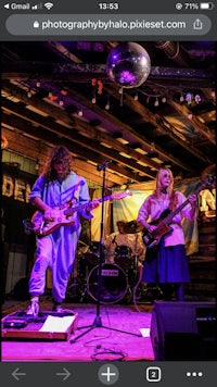 image may contain person, on stage, playing a musical instrument and indoor