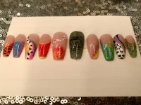a group of colorful nail designs on a piece of paper