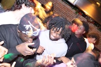 a group of people dancing at a party