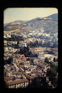 a view of a city from the top of a hill