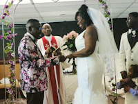 a bride and groom exchanging their vows in a church