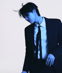 a young man in a suit and tie