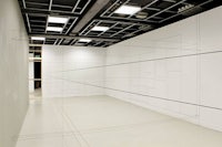 an empty room with lines drawn on the wall