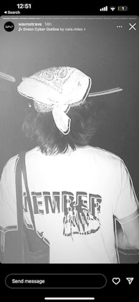 a black and white photo of a man with a bandana on his head