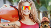 a woman in a red bikini holding a surfboard and sunglasses