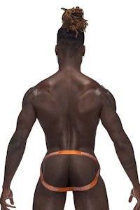the back of a man wearing an orange thong