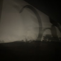 a silhouette of a person in a dark room