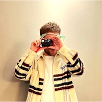 a man is taking a picture of himself with a camera