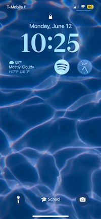 a phone with a blue background and a clock on it