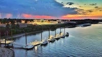 a boat docked in the water at dusk
