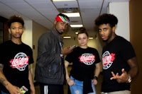 a group of people standing in a hallway