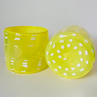 two yellow vases with white dots on them