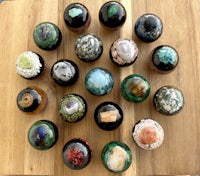 a group of stones arranged in a circle on a wooden table