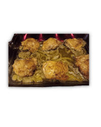 chicken breasts in a baking dish with onions