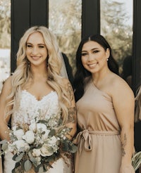 the bride and her bridesmaids pose for a photo