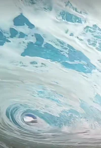 a surfer is riding a wave in the ocean