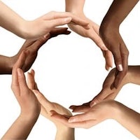 multiracial hands forming a circle on a white background