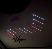 a room with red and blue lights in the background