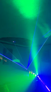 an image of a green laser beam in a room