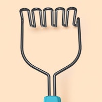 a metal spatula on a beige background