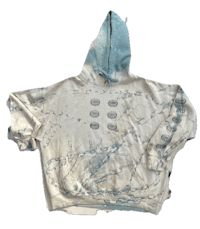 a white hoodie with a blue design on it