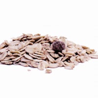 a pile of rolled oats on a white background