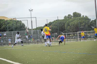 a group of people playing a game of soccer