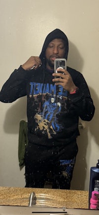 a man taking a selfie in a bathroom