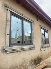 a house with two windows and a door