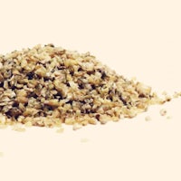 a pile of dried oats on a white background