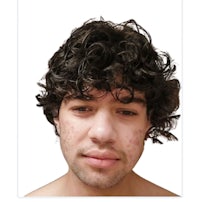 a photo of a man with curly hair