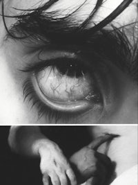 a black and white photo of a person's eye