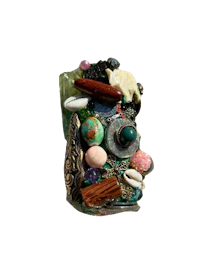 a ring with a lot of beads and stones on it