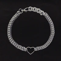 a silver chain bracelet with a heart on it