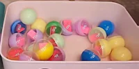 easter eggs in a plastic container on a table