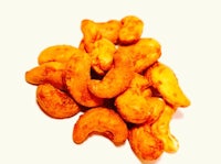 a pile of cashews on a white background