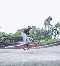 a group of people doing tricks on their bikes