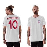 a man wearing a white t - shirt with the number 10 on it