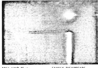 a black and white photo of a plane flying in the sky