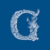 an ornate letter g on a blue background