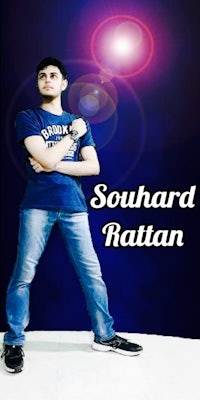 a man in jeans and a blue shirt is standing in front of a blue background