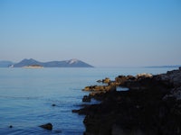 a body of water with rocks on it