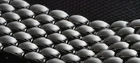 a close up of a bunch of silver beads